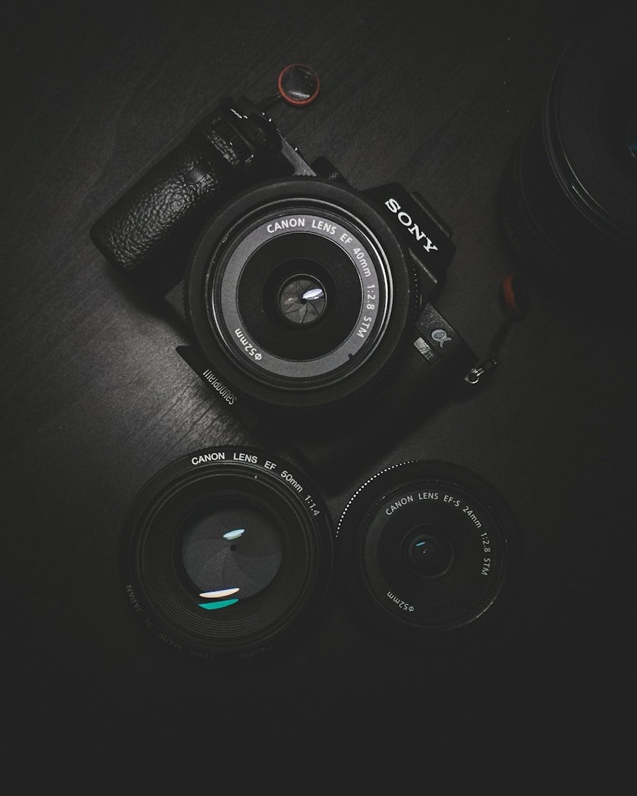 A camera and lenses in a dark product composition
